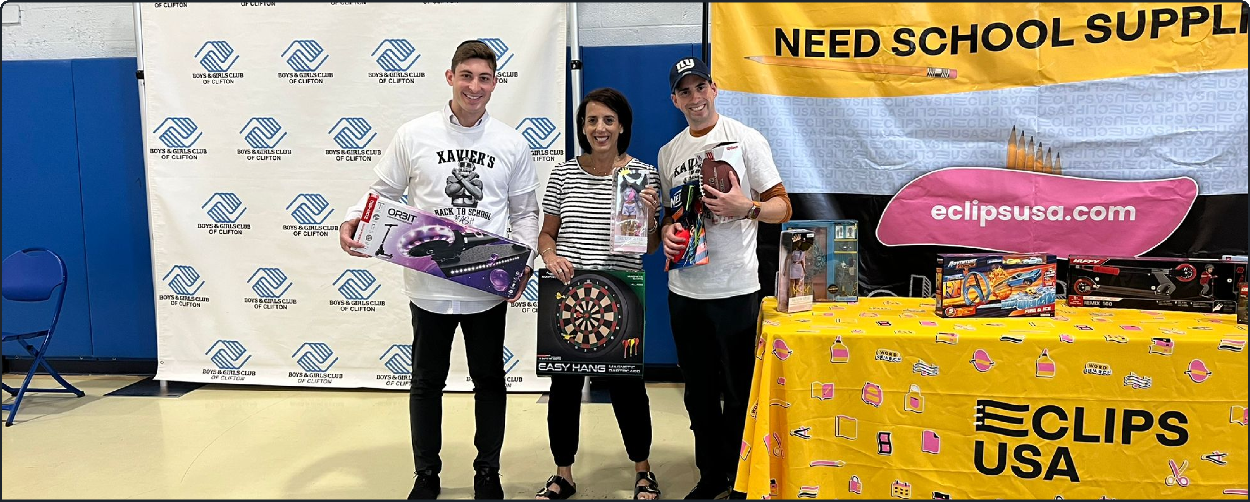 The three employees of E-Clips USA standing together and holding toys.